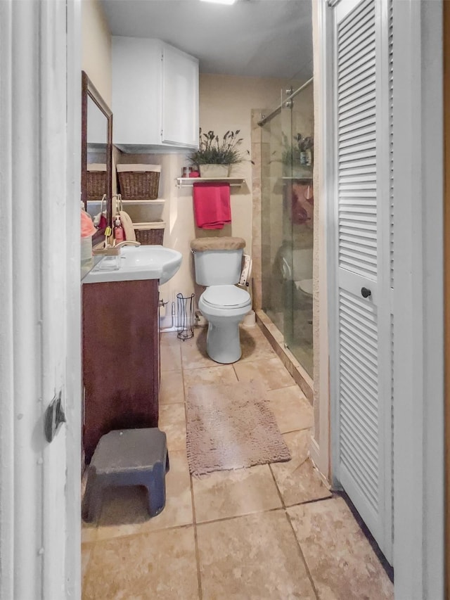 full bath with a stall shower, vanity, and toilet