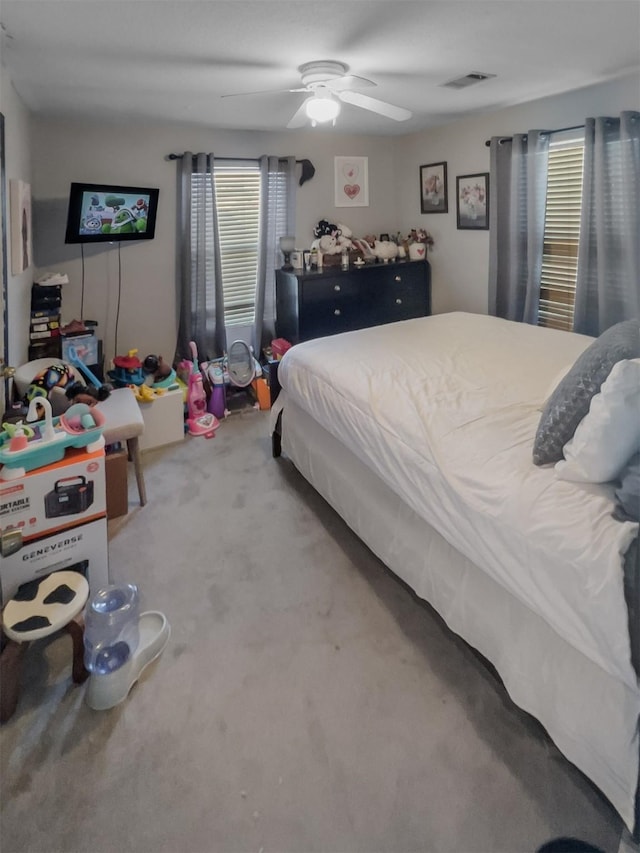 bedroom featuring carpet, visible vents, and ceiling fan