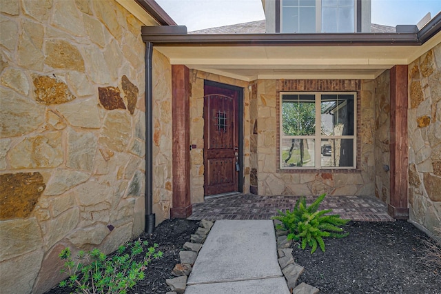 property entrance with stone siding