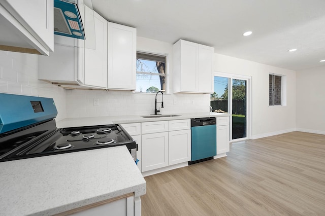 kitchen with black / electric stove, a sink, white cabinets, dishwasher, and light wood finished floors