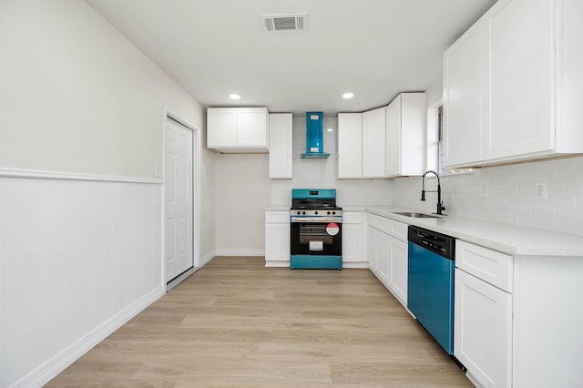 kitchen with stainless steel range with gas cooktop, visible vents, a sink, wall chimney range hood, and dishwashing machine