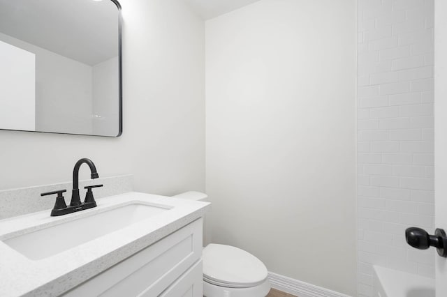 full bath with toilet, shower / bathtub combination, baseboards, and vanity