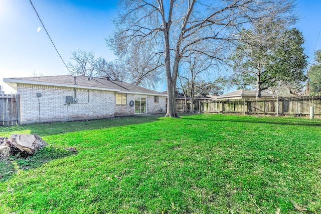 view of yard featuring a fenced backyard