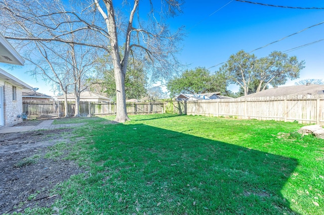 view of yard featuring a fenced backyard