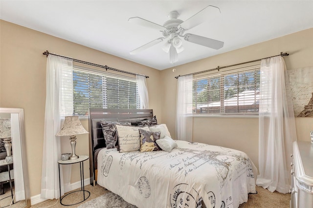 4325 Gatewood Rd, Crosby, TX 77532 - bedroom featuring light carpet, baseboards, and a ceiling fan