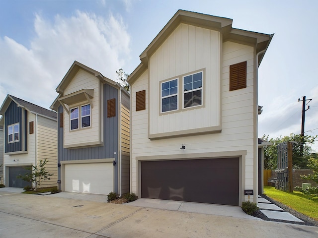 view of front of house with concrete driveway and an attached garage