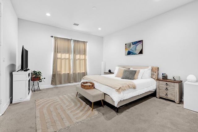 bedroom with light carpet, baseboards, visible vents, and recessed lighting