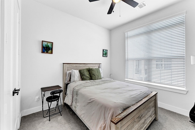 bedroom with ceiling fan, carpet, visible vents, and baseboards