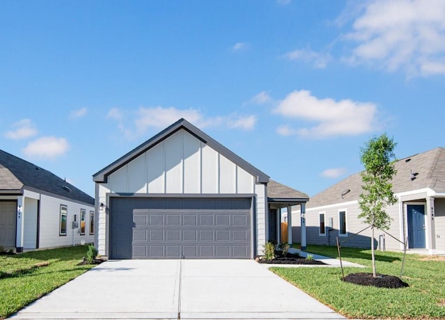 8106 Vanilla Orchid Dr, Houston, TX 77016 - view of front of house featuring board and batten siding, driveway, and a front yard