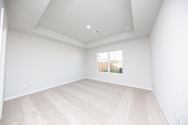 8106 Vanilla Orchid Dr, Houston, TX 77016 - carpeted spare room with visible vents, baseboards, and a tray ceiling