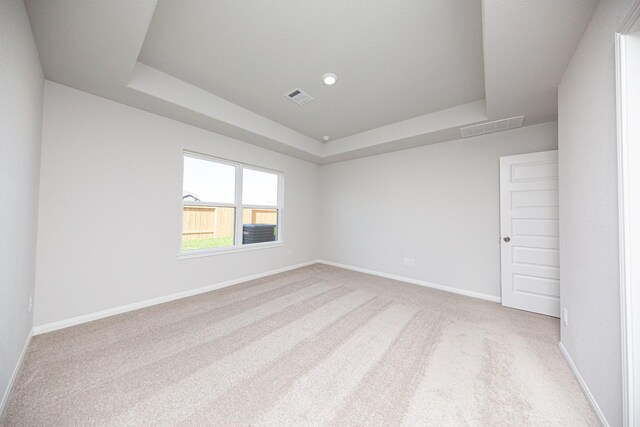 8106 Vanilla Orchid Dr, Houston, TX 77016 - unfurnished room featuring a tray ceiling, baseboards, carpet, and visible vents