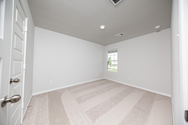 8106 Vanilla Orchid Dr, Houston, TX 77016 - spare room with a textured ceiling, carpet flooring, baseboards, and visible vents