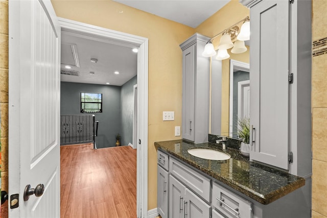 bathroom featuring wood finished floors and vanity