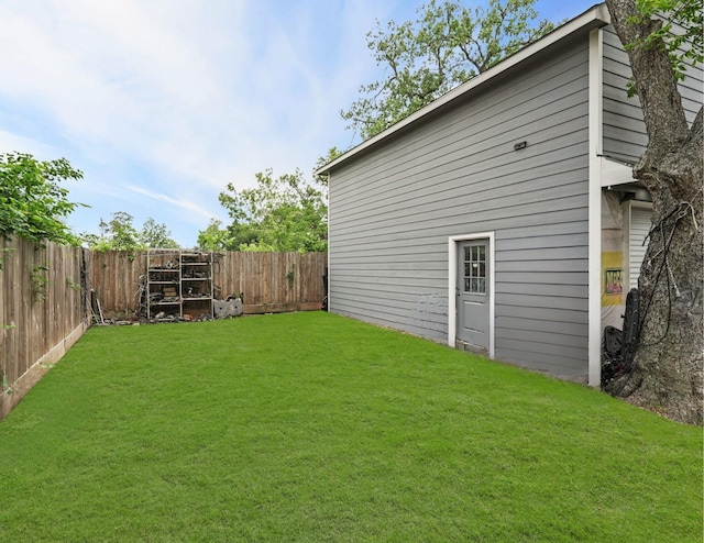 view of yard with a fenced backyard