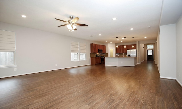 unfurnished living room featuring dark wood-style floors, ceiling fan, baseboards, and recessed lighting