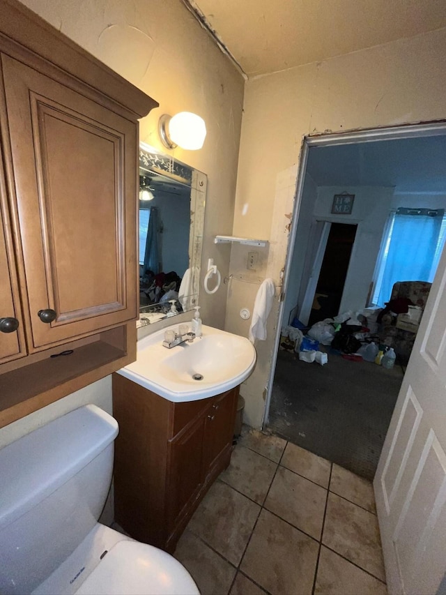 bathroom featuring vanity, toilet, and tile patterned floors