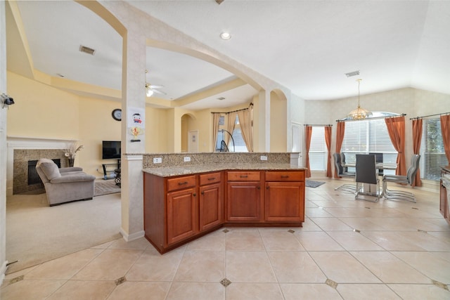 kitchen with open floor plan, light tile patterned flooring, visible vents, and pendant lighting