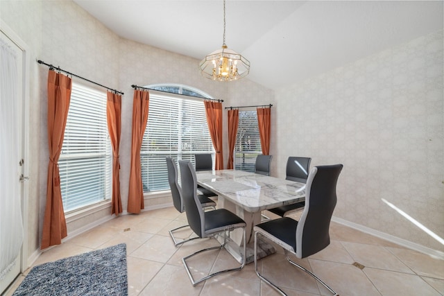 dining area featuring wallpapered walls, baseboards, lofted ceiling, a notable chandelier, and light tile patterned flooring