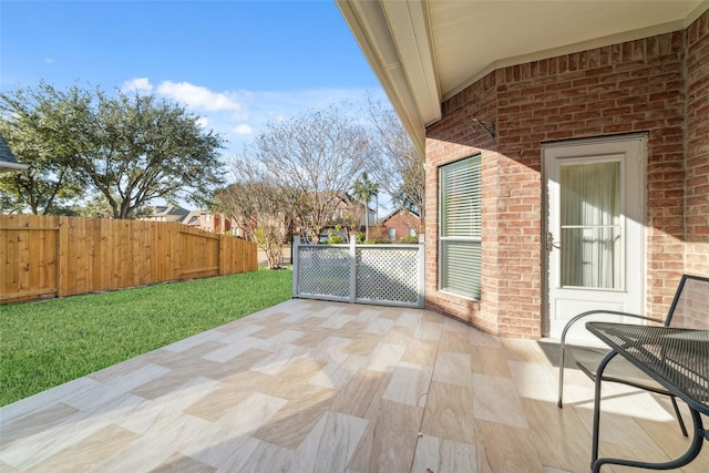 view of patio / terrace featuring fence