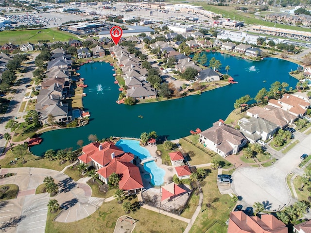 birds eye view of property featuring a residential view and a water view