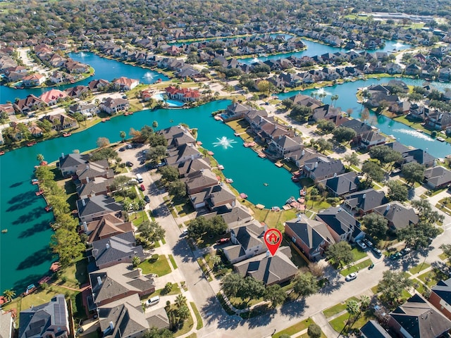 aerial view featuring a residential view and a water view