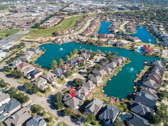 aerial view with a water view and a residential view