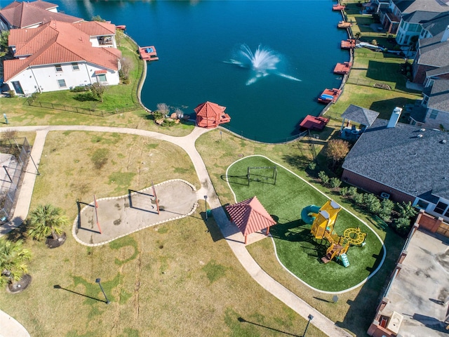 birds eye view of property with a water view and a residential view