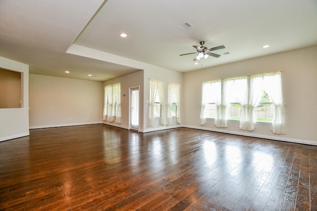 unfurnished room featuring recessed lighting, dark wood-style flooring, and visible vents