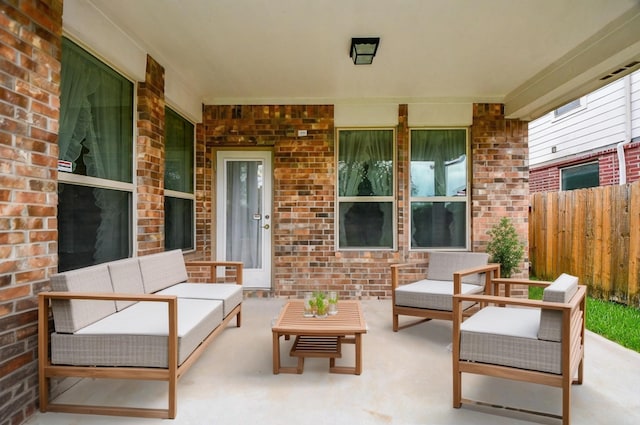 view of patio / terrace with outdoor lounge area and fence