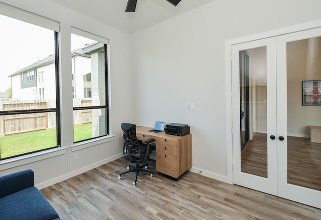 office featuring french doors, a ceiling fan, baseboards, and wood finished floors