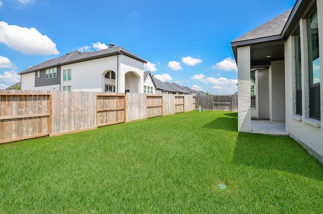 view of yard with a patio and a fenced backyard