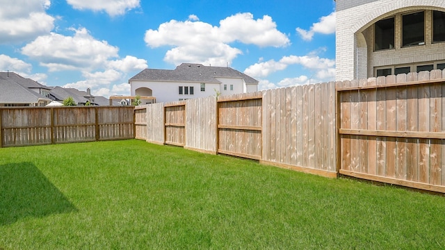 view of yard featuring a fenced backyard