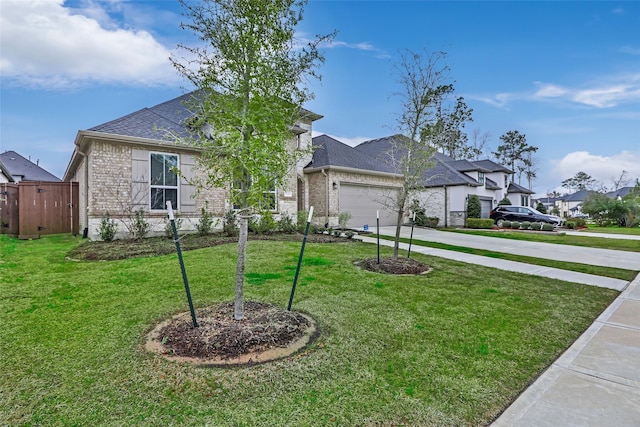 view of front of property featuring brick siding, a shingled roof, concrete driveway, an attached garage, and a front yard