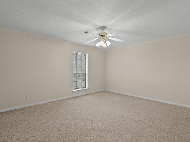 unfurnished room with visible vents, a ceiling fan, ornamental molding, a textured ceiling, and carpet flooring