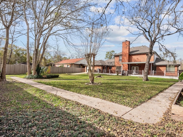 view of yard with a residential view and fence