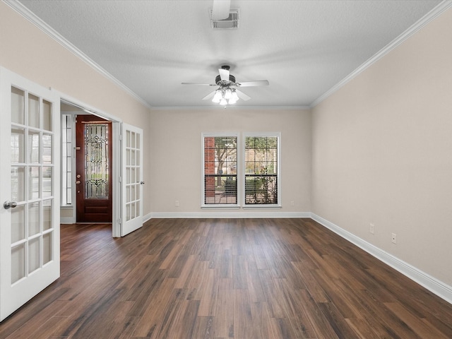 spare room with dark wood-style floors, french doors, visible vents, and baseboards