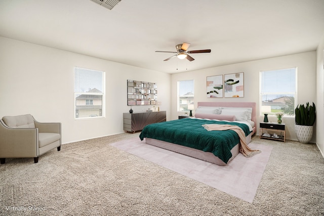 bedroom featuring carpet, visible vents, and a ceiling fan