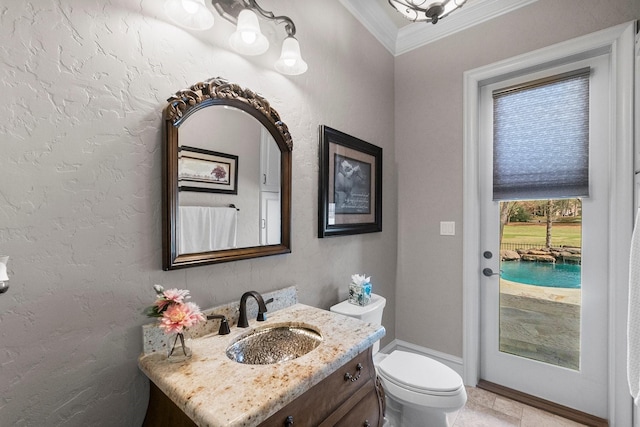 bathroom with toilet, a textured wall, vanity, and crown molding