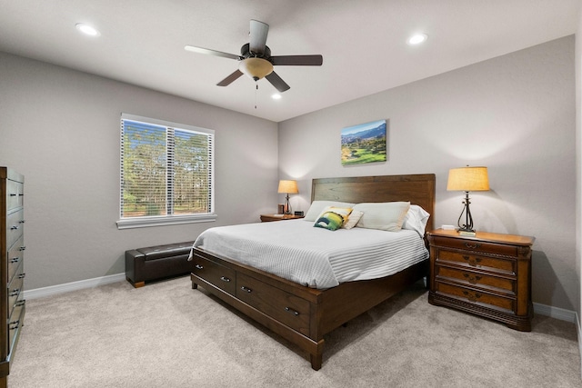 bedroom featuring a ceiling fan, recessed lighting, light carpet, and baseboards