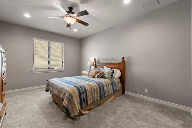 bedroom with recessed lighting, baseboards, visible vents, and light colored carpet