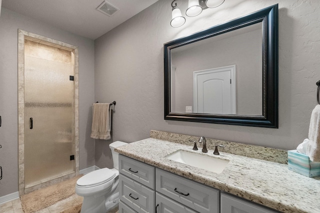 bathroom featuring visible vents, toilet, a shower stall, vanity, and tile patterned flooring