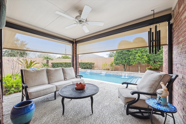 view of patio / terrace featuring a ceiling fan, a fenced in pool, a fenced backyard, and an outdoor living space