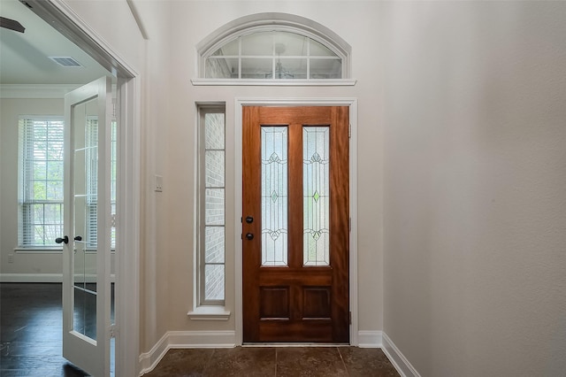 foyer featuring visible vents and baseboards