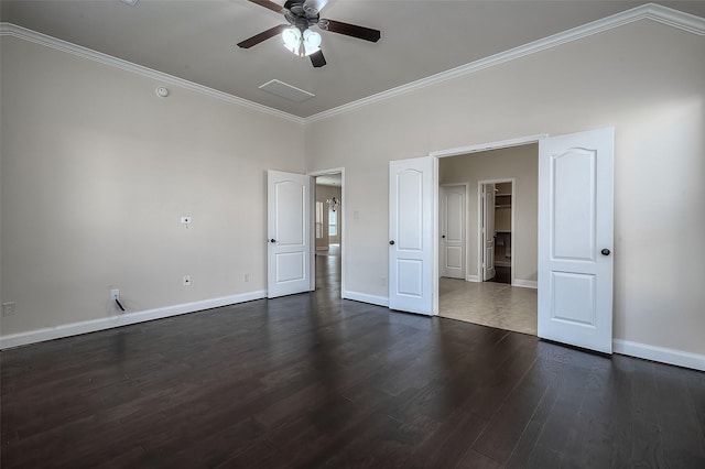 unfurnished bedroom with dark wood-style floors, baseboards, and ornamental molding