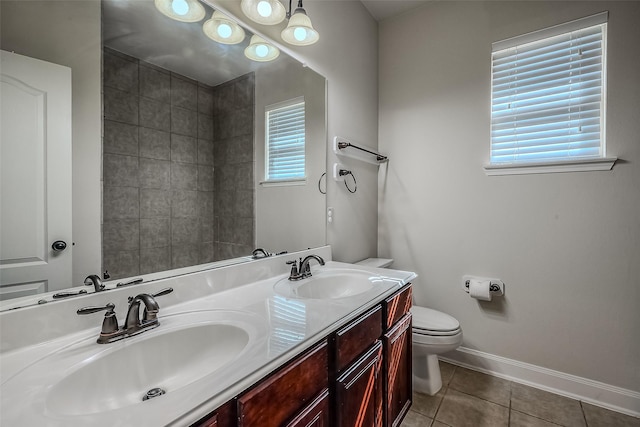 full bath with tile patterned flooring, a sink, toilet, and baseboards