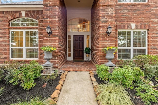 entrance to property with brick siding