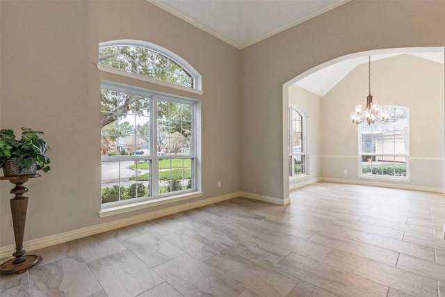 unfurnished room featuring arched walkways, baseboards, a chandelier, and a wealth of natural light