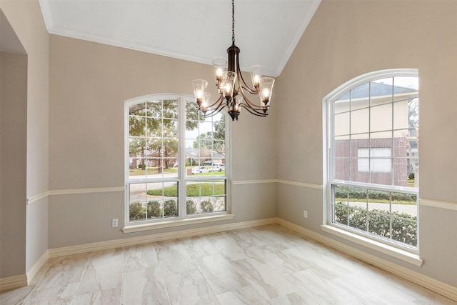 spare room with a wealth of natural light, lofted ceiling, marble finish floor, and baseboards