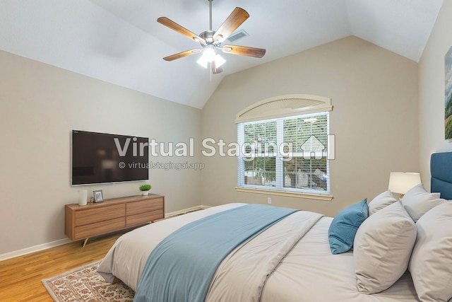 bedroom with lofted ceiling, ceiling fan, baseboards, and light wood-style floors