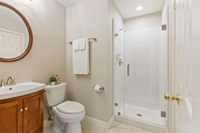 full bath featuring a stall shower, baseboards, vanity, and toilet